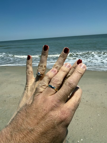 Our wedding rings at the beach