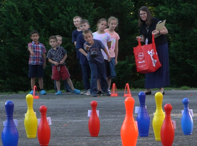 Kerri playing games with kids.